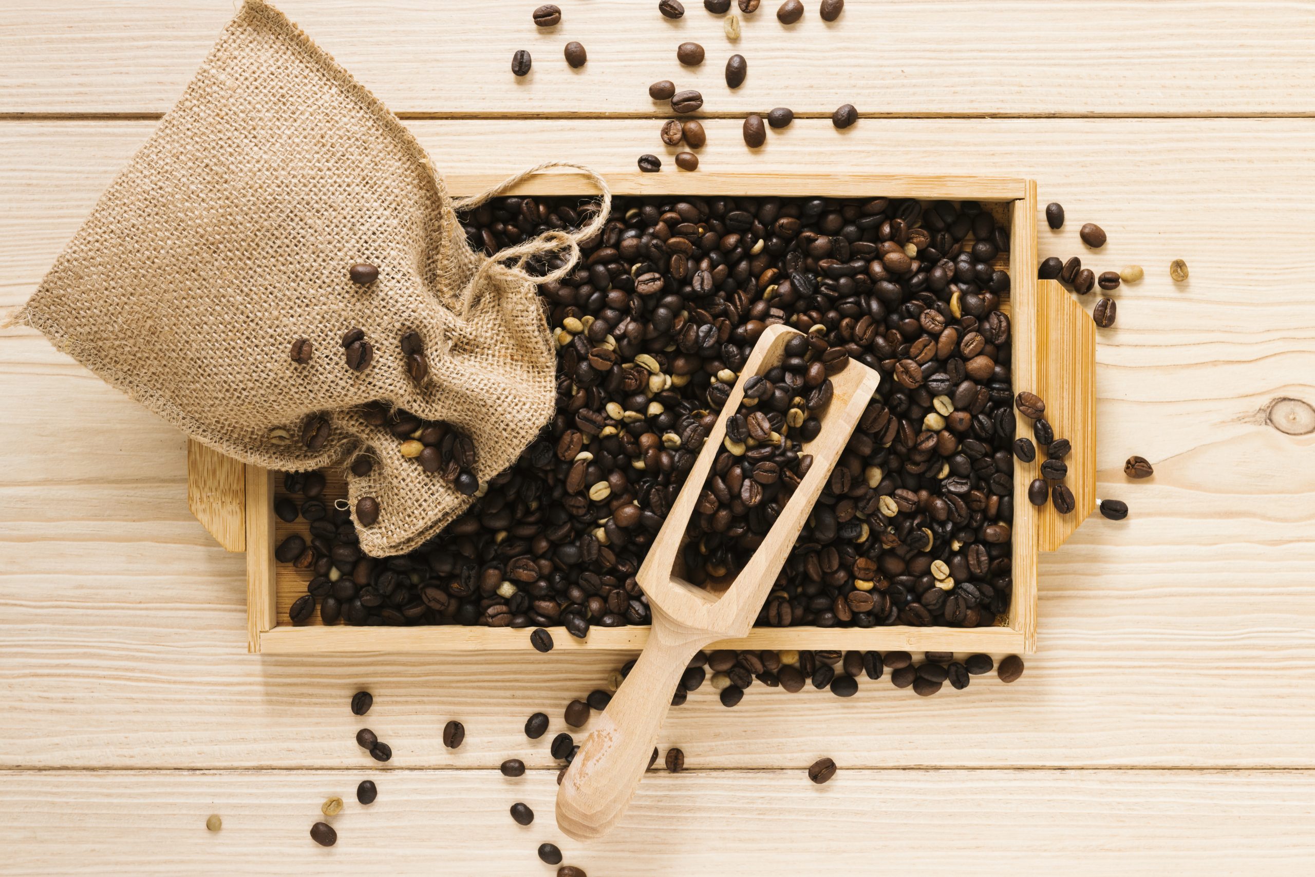 top-view-wooden-tray-with-coffee-beans
